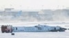 The wreckage of a Delta Air Lines-operated CRJ900 aircraft lays on the runway after a plane crash at Toronto Pearson International Airport in Mississauga, Ontario, Canada, Feb. 18, 2025. 