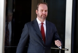 FILE - Rick Gates, former campaign aide to U.S. President Donald Trump, departs after a bond hearing at U.S. District Court in Washington, Dec. 11, 2017.