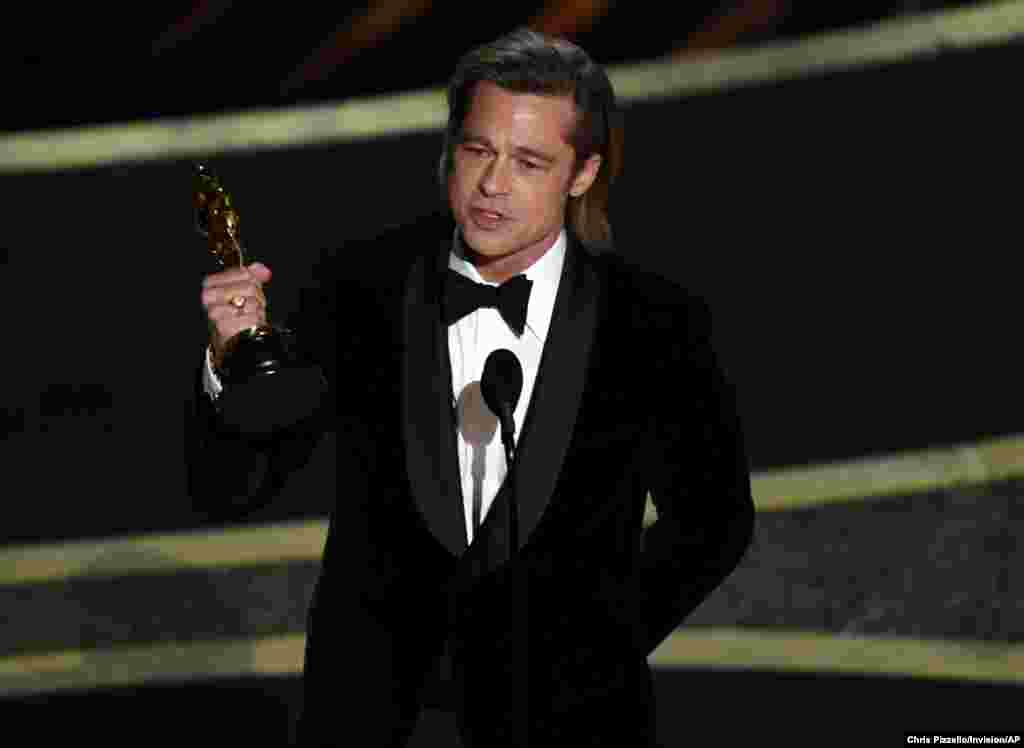 Brad Pitt accepts the award for best performance by an actor in a supporting role for &quot;Once Upon a Time in Hollywood&quot; at the Oscars at the Dolby Theatre in Los Angeles, Feb. 9, 2020.