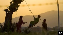 Pakistani children play on the outskirts of Islamabad, Pakistan in 2013 file photo. (AP Photo/Anjum Naveed)