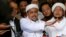 Leader of Islamic Defenders Front (FPI) Habib Rizieq (C) talks to reporters at a court after the blasphemy trial of Jakarta's incumbent governor Basuki Tjahaja Purnama, also known as Ahok, in Jakarta, Indonesia, Feb. 28, 2017. 
