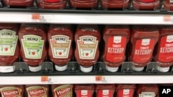 In this June 12, 2017, photo, varieties of ketchup are displayed at Target in Wilmington, Mass. (AP Photo/Elise Amendola)