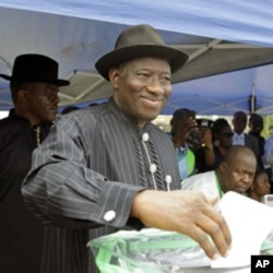 Nigerian President Goodluck Jonathan casts his ballot in his home village of Otuoke, Bayelsa state.