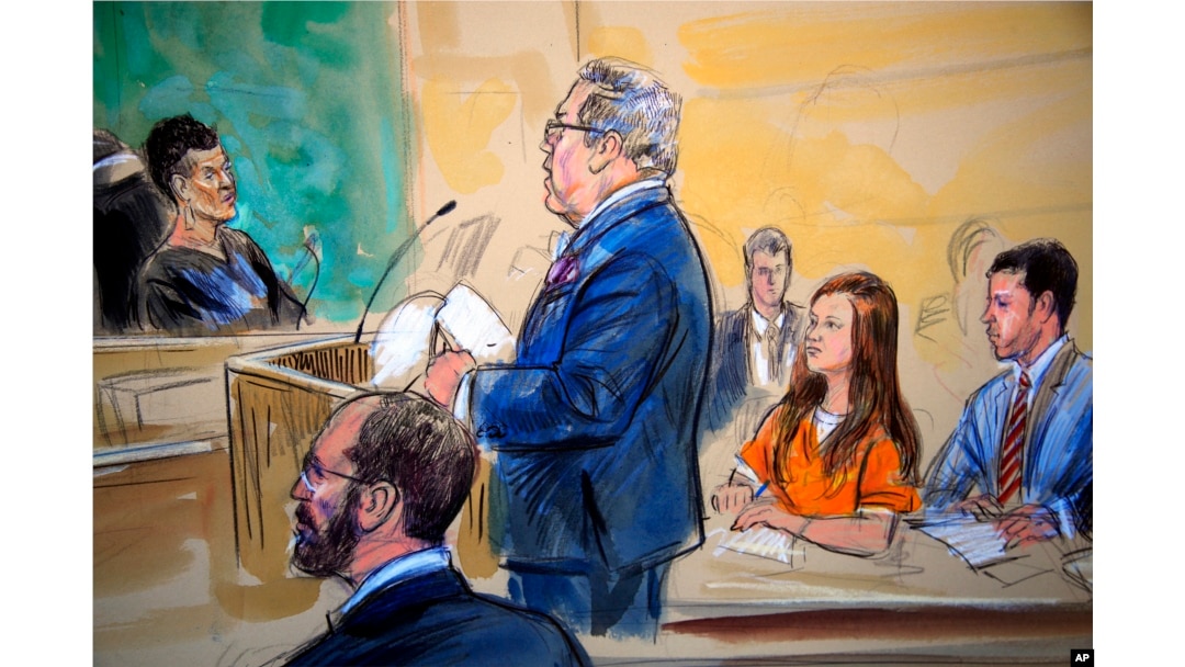 This courtroom sketch depicts Maria Butina, in orange suit, a 29-year-old gun-rights activist suspected of being a covert Russian agent, listening to her attorney Robert Driscoll, standing, as he speaks to Judge Deborah Robinson, left.