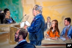 This courtroom sketch depicts Maria Butina, in orange suit, a 29-year-old gun-rights activist suspected of being a covert Russian agent, listening to her attorney Robert Driscoll, standing, as he speaks to Judge Deborah Robinson, left.