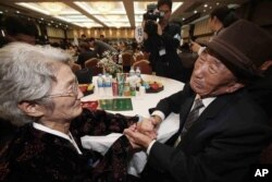 South Korean Kim Bock-rack, right, meets with his North Korean sister Kim Jeon Soon during the Separated Family Reunion Meeting at Diamond Mountain resort in North Korea, Oct. 20, 2015.