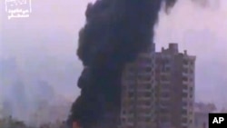 Ugarit News image of smoke and fire billowing from an explosion in Damascus, Syria, Feb. 6, 2013