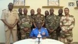 FILE - Colonel Major Amadou Abdramane makes a statement on July 26, 2023, in Niamey, Niger, as a delegation of military officers appeared on Niger state TV to announce their coup. Journalists have found it increasingly risky to report on the junta. (ORTN via AP)