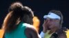 United States' Serena Williams consoles Ukraine's Dayana Yastremska after winning their third round match at the Australian Open tennis championships in Melbourne, Australia, Saturday, Jan. 19, 2019.