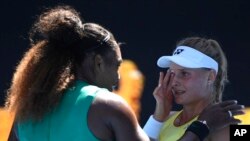 United States' Serena Williams consoles Ukraine's Dayana Yastremska after winning their third round match at the Australian Open tennis championships in Melbourne, Australia, Saturday, Jan. 19, 2019.