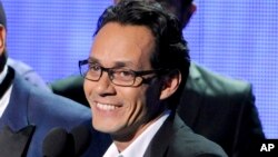 FILE - Marc Anthony, winner of the award for best salsa album, speak on stage at the 15th annual Latin Grammy Awards at the MGM Grand Garden Arena in Las Vegas, Nov. 20, 2014.