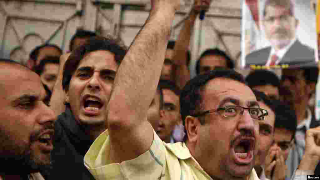 Supporters of Egypt's ousted President Mohammed Morsi chant slogans against Egyptian Defense Minister Gen. Abdel-Fattah el-Sissi at Nasr City, where protesters have installed a camp and hold daily rallies, in Cairo, Egypt, Sunday, July 28, 2013. Deadly cl