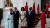 U.S. President Barack Obama poses for a picture with his wife Michelle Obama and Senegalese President Macky Sall and his wife Mariame Faye Sall, at the presidential palace in Dakar, Senegal, June 27, 2013.