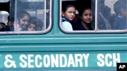 FILE - Kenyan students ride the bus to their school, Jan. 14, 2008.