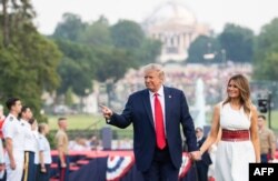 FILE - President Donald Trump and first lady Melania Trump host the 2020 "Salute to America" event in honor of U.S. Independence Day, on the South Lawn of the White House, in Washington, July 4, 2020.