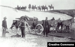 Army contractors gathering the bodies of the victims of the Wounded Knee massacre, January 1891.