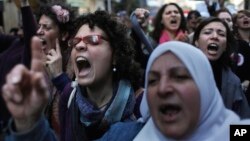 Manifestation au Caire, en Egypte, à l'occasion de la Journée internationale de la femme, le 8 mars 2012.