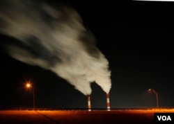 Smoke rising from the stacks of the La Cygne Generating Station coal-fired power plant in La Cygne, Kansas.