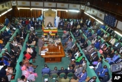 FILE - The Ugandan Parliament votes on a harsh new anti-gay bill, on Tuesday, March 21, 2023.