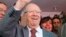 Beji Caid Essebsi (C), Nidaa Tounes party leader, gestures outside Nidaa Tounes headquarters in Tunis, October 28, 2014.