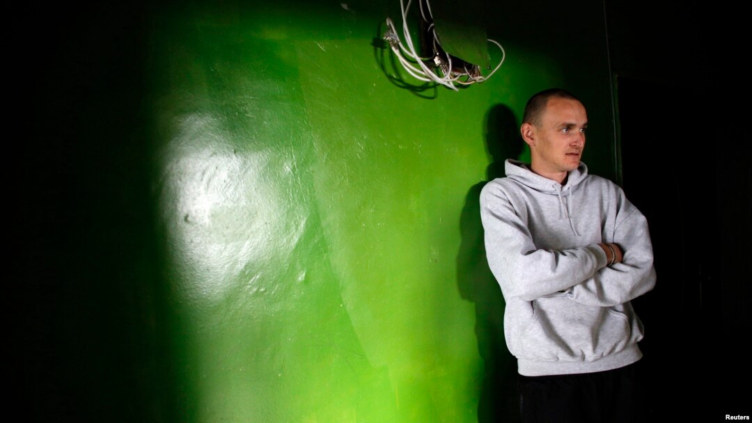 Bulgarian Alexander Angelov, 27, looks on as he stands outside his apartment in a block in the town of Vratsa, some 110km (68 miles) north of Sofia, Apri. 10, 2013.