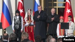 Turkish President Tayyip Erdogan, center left, and his Russian counterpart Vladimir Putin attend groundbreaking ceremony of the Akkuyu Nuclear Power Plant through videolink, at the Presidential Palace in Ankara, Turkey April 3, 2018. 