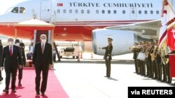 Turkish President Tayyip Erdogan reviews a guard of honor with Turkish Cypriot leader Ersin Tatar upon his arrival in northern Nicosia, Cyprus, Nov. 15, 2020. (Mustafa Oztartan/Presidential Press Office/Handout)