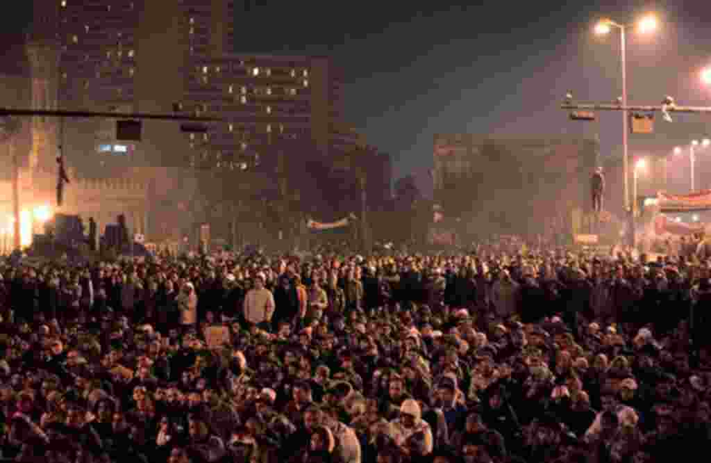February 2: Effigies of Egyptian President Hosni Mubarak can be seen hanging from traffic lights, as Egyptian anti-government protesters gathered in Tahrir Square. (Lefteris Pitarakis/AP)
