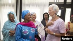 FILE - International Monetary Fund Managing Director Christine Lagarde meets with women leaders at the Hotel Pullman for lunch, Jan. 9, 2016 in Douala, Cameroon.
