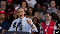 President Barack Obama speaks to Costco employees during a visit to a local Costco in Lanham, Maryland, Jan. 29, 2014. 