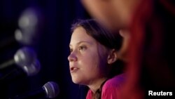 Swedish climate activist Greta Thunberg speaks with other child petitioners from 12 countries who presented a landmark complaint to protest the lack of government action on the climate crisis during a press conference in New York, Sept. 23, 2019.