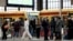 FILE - Passengers wear face masks at Friedrichstrasse station during COVID-19 lockdown in Berlin, July 21, 2021