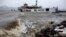 An historic ferry boat named the Binghamton is swamped by the waves on the Hudson River in Edgewater, N.J., Monday, Oct. 29, 2012 as Hurricane Sandy lashed the East Coast.