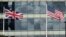 FILE - A British Union flag (L) and U.S. flag are seen flying in front of an office building in London, March 30, 2016. Post-Brexit relations between the two countries have been a matter of debate.