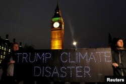 Demonstrators hold a banner during a protest against U.S. President Donald Trump in London, Feb. 20, 2017.