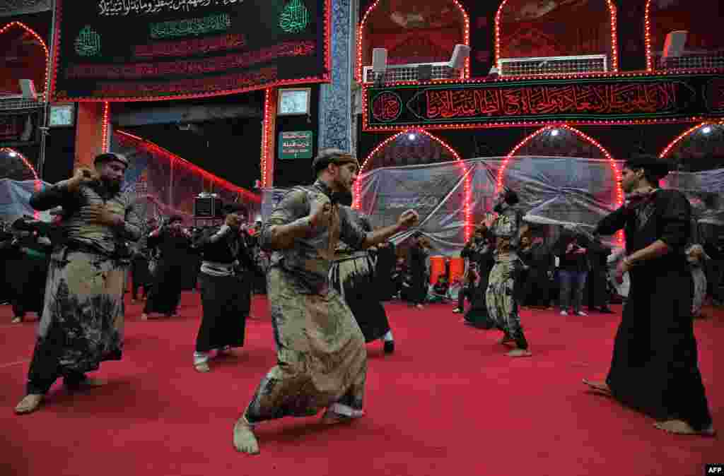 Shi&#39;ite pilgrims take part in a ceremony during the 10-day mourning period leading up to Ashura, in Iraq&#39;s holy city of Karbala.