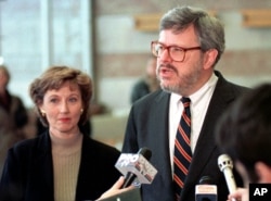 FILE - James Rosapepe, the United States Ambassador to Romania, talks to reporters as his wife, Sheilah Kast, looks on shortly after arriving in Bucharest, Feb. 1, 1998.