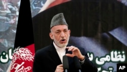 Afghan President Hamid Karzai speaks at a press conference during a ceremony at a military academy on the outskirts of Kabul, Afghanistan, June 18, 2013.