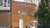 FILE - People walk near the main entrance to the Borough of Manhattan Community College in New York, April 13, 2017..