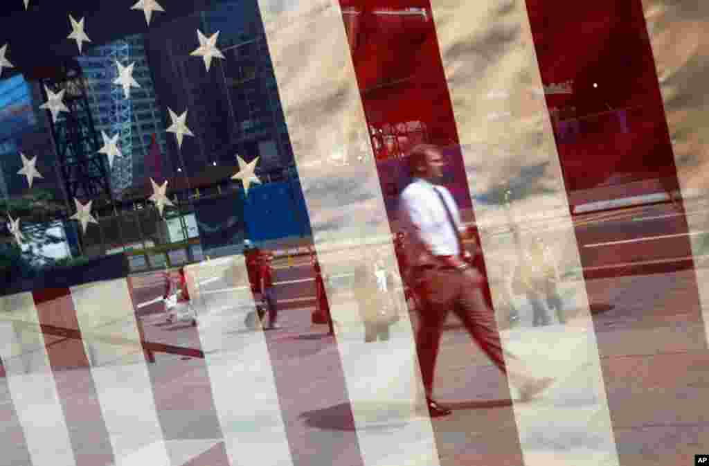 September 8: A man is reflected in a window across from the World Trade Center construction site in New York. REUTERS/Jim Young