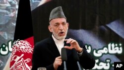 하미드 카르자이 아프가니스탄 대통령이, 18일 카불에서 열린 치안권 이양식에서 발언하고있다.