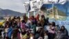 Des migrants manifestent à Lesbos, Grèce, le 19 avril 2018.