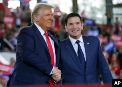 FILE - Donald Trump greets Senator Marco Rubio during a run  rally astatine  J.S. Dorton Arena, Nov. 4, 2024, successful  Raleigh, North Carolina. Trump, present  president-elect, has tapped Rubio to go  U.S. caput   of state.