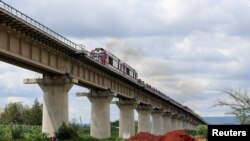 FILE - A general view shows a cargo train on the Standard Gauge Railway (SGR) line constructed by the China Road and Bridge Corporation (CRBC) and financed by the Chinese government in Athi River, Kenya May 16, 2023.