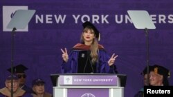 Taylor Swift attends NYU graduation ceremony at Yankee Stadium in New York