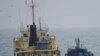 FILE - This photo released by Japan's Ministry of Defense shows what it says is the North Korean-flagged tanker Yu Jong 2, left, and Min Ning De You 078 lying alongside in the East China Sea, Feb. 16, 2018. 