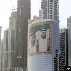 Images of Sheik Mohammed bin Rashid Al-Maktoum, UAE prime minister and ruler of Dubai, left, and Sheik Khalifa bin Zayed Al-Nahyan, UAE president, right, adorns a tower at Internet City, in Dubai (File Photo).