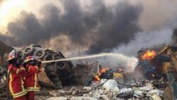 Firefighters spray water at a fire after an explosion was heard in Beirut, Lebanon August 4, 2020.