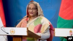 FILE - Bangladeshi Prime Minister Sheikh Hasina speaks at a news conference in Budapest, Hungary, Nov. 29, 2016. 
