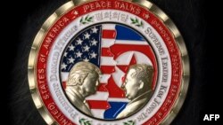 A coin for the upcoming U.S.-North Korea summit is seen in Washington, May 21, 2018. 